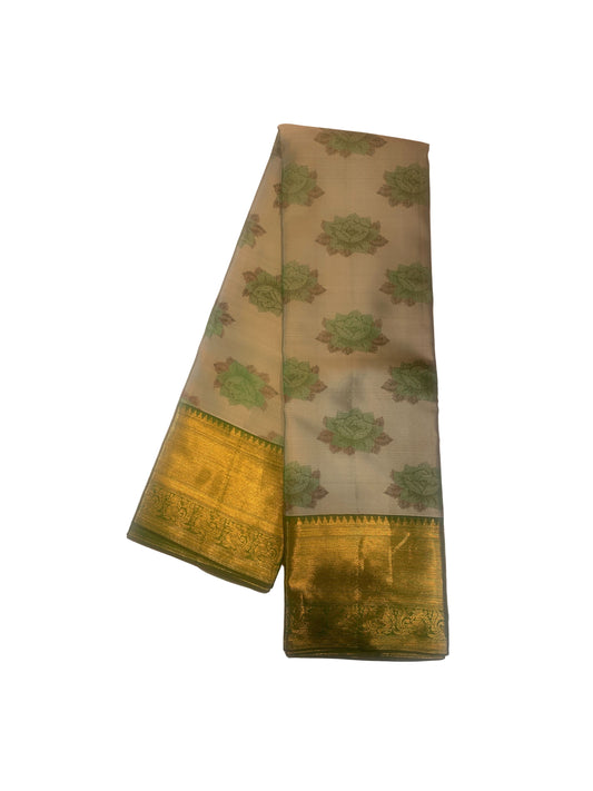 Subtle floral green silk saree with long golden border