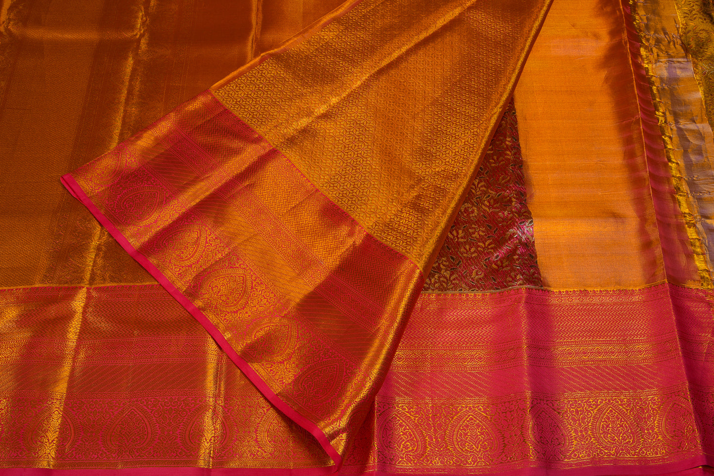 Shimmering golden pattu saree with blushy border