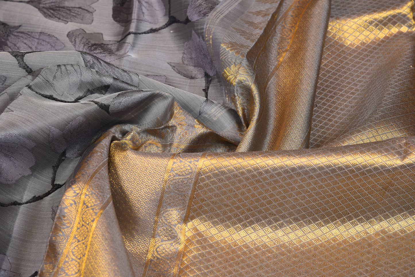 Greyish floral silk saree with blushy silver zari