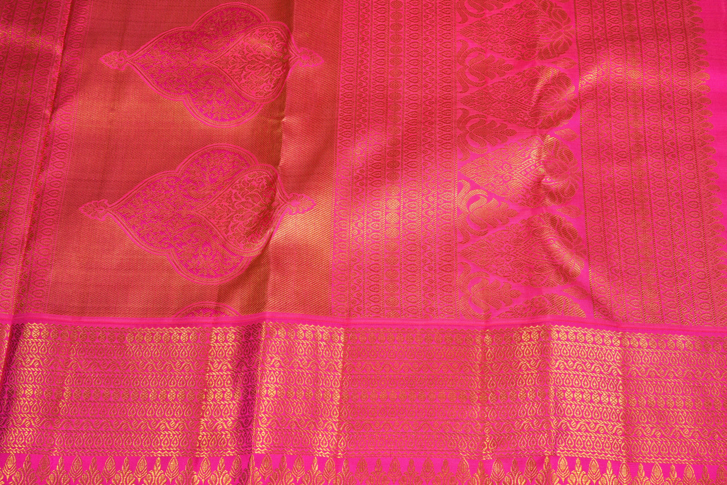 Majestic golden pattu saree with a  blush of long pinky border